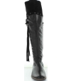 Tall black leather boots that stretch over the knees Tall black leather boots that stretch over the knees