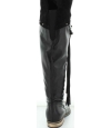 Tall black leather boots that stretch over the knees Tall black leather boots that stretch over the knees